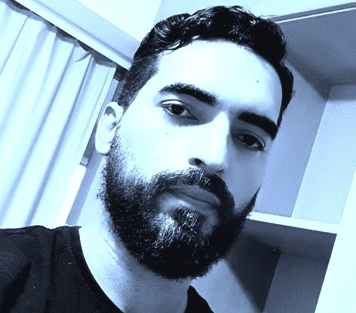 Black and white portrait of a man with a beard and glasses